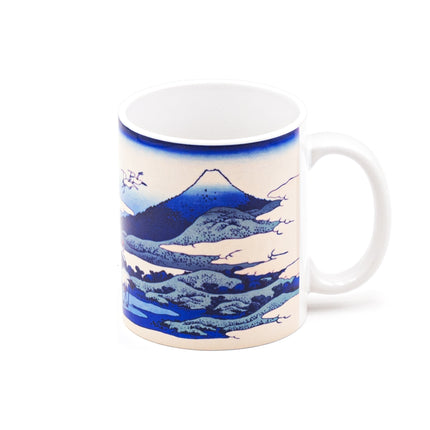 Japanese Blue Ceramic Cup with Mountain, Crane, and Cloud Designs